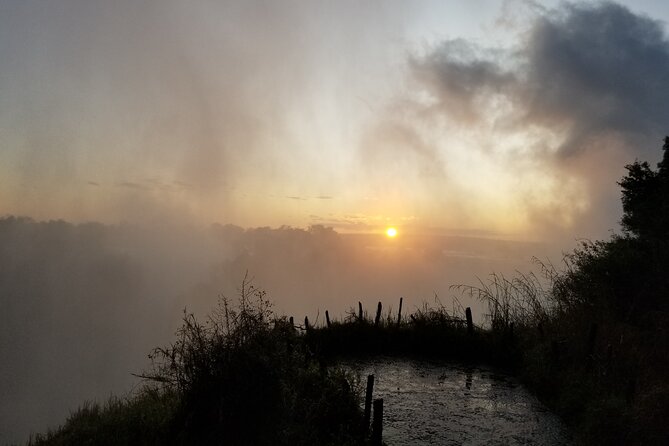 Guided Falls Tour & Zambezi River Cruise Combo - Day one: airport pickup and the Zambezi at sunset