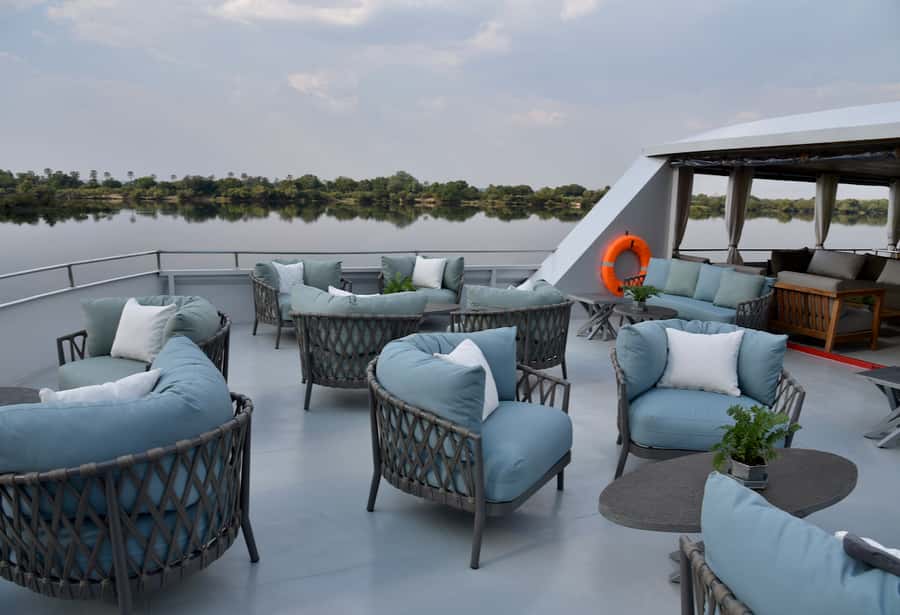 Victoria Falls Scenic Guided Tour with Sunset Boat Cruise - The Zambezi at sunset, with wildlife on the riverbank